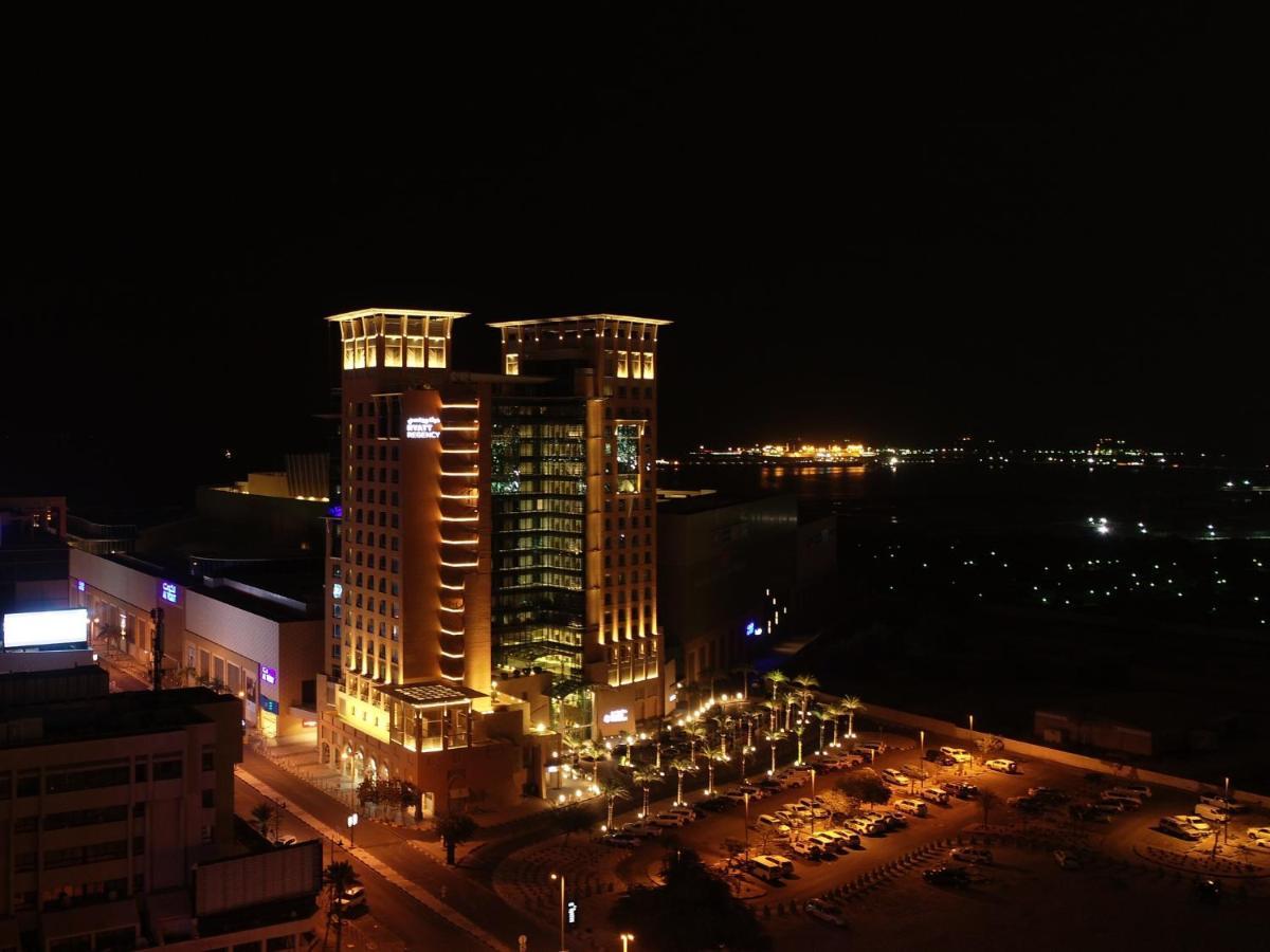 Hyatt Regency Al Kout Mall Kuwait City Exterior photo The hotel at night