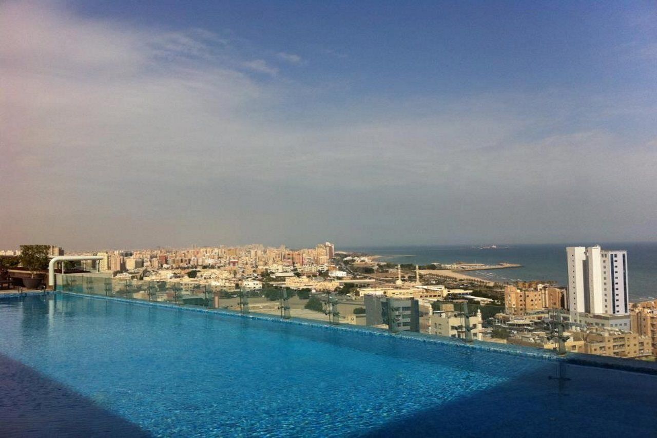 Hyatt Regency Al Kout Mall Kuwait City Exterior photo View of the city from the rooftop pool of the Grand Hotel